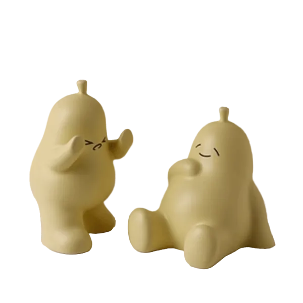 Ornement en porcelaine de support de livre de poire de dessin animé étreignant