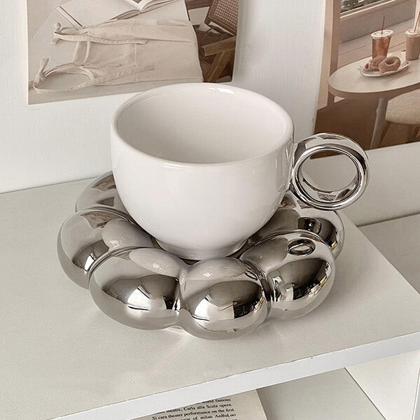 White Cup and Silver Saucer