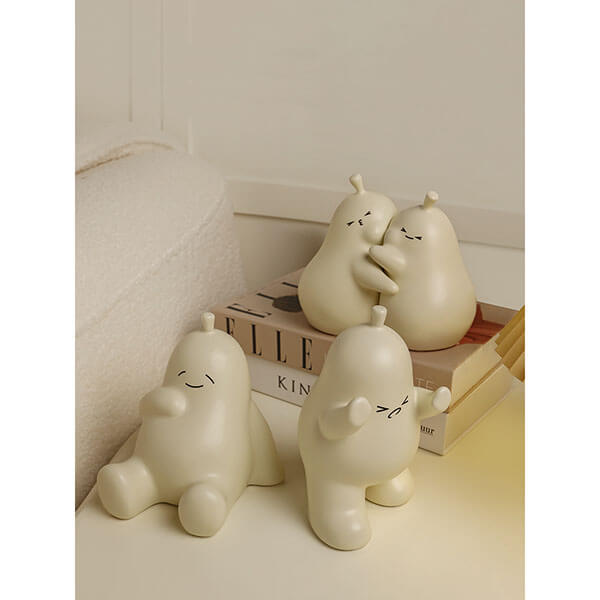 Hugging Cartoon Pear Book Stand Porcelain Ornament